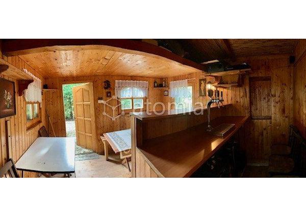 Pekný pozemok s dvomi drevostavbami a základovou doskou