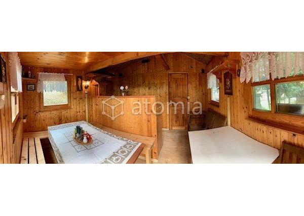 Pekný pozemok s dvomi drevostavbami a základovou doskou