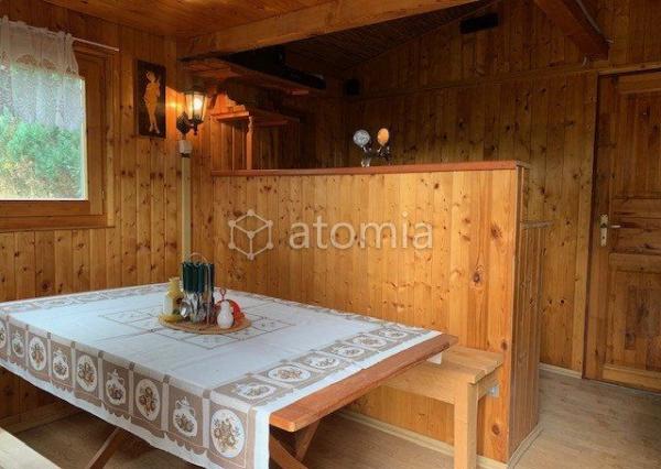 Pekný pozemok s dvomi drevostavbami a základovou doskou